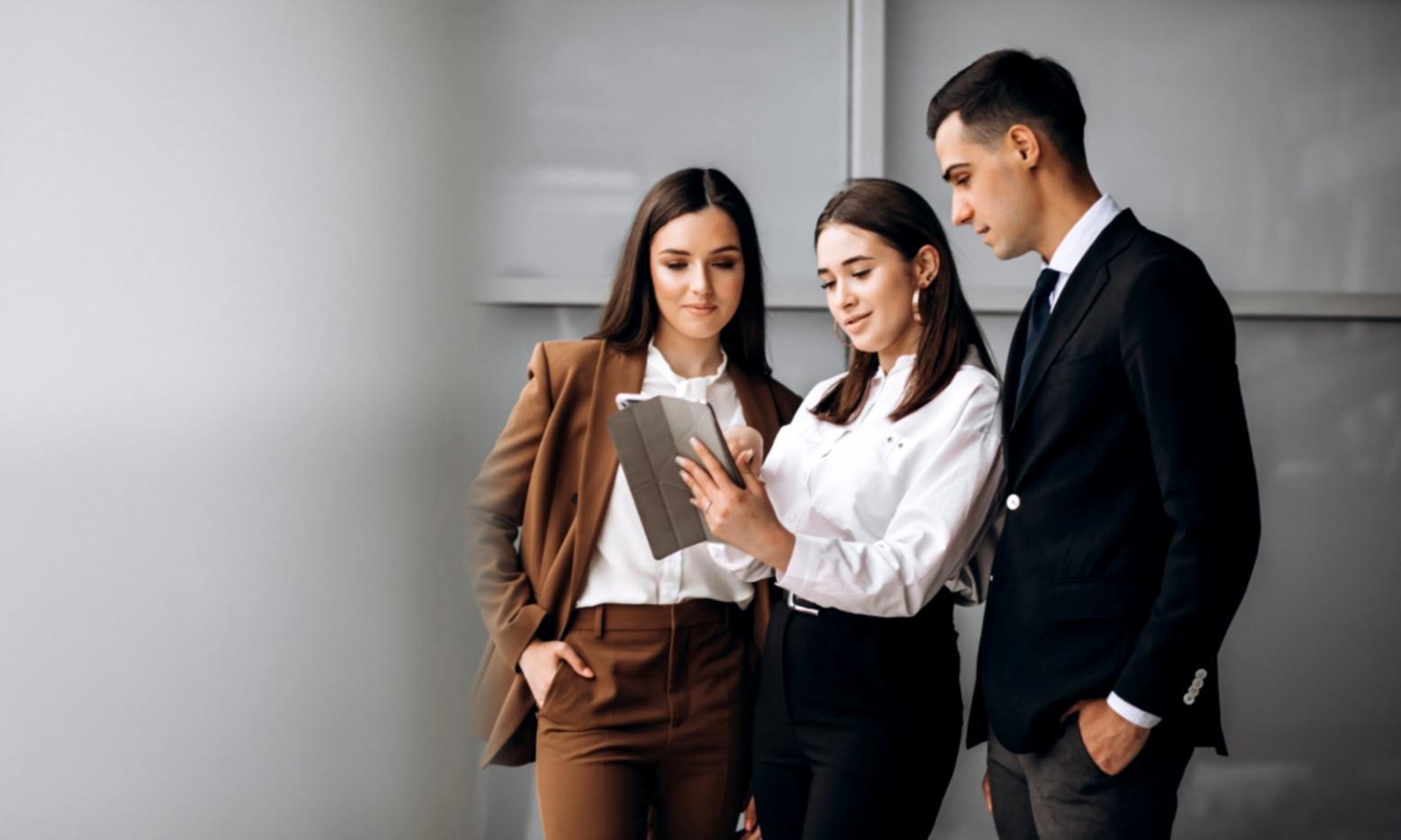 Financial professional reviewing business analysis documents with charts and graphs